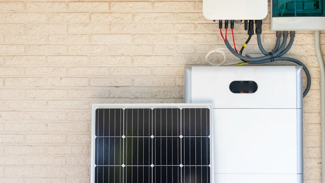 Home battery and inverter mounted on a wall